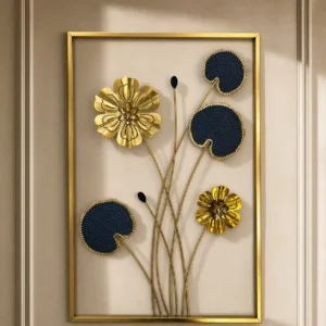 Metal wall art with gold flowers and navy blue lily pads in a gold rectangular frame