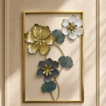Metal wall art with gold blue and white floral vine design in a gold rectangular frame